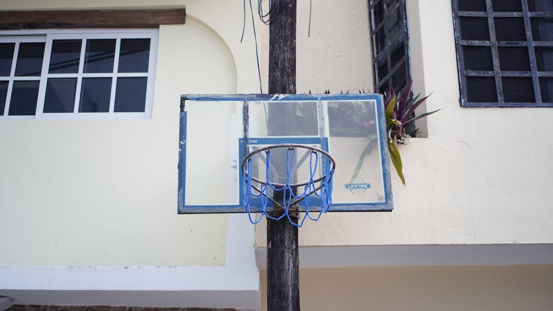 Service a-basketball-hoop-in-front-of-a-building-xaepooto2sg